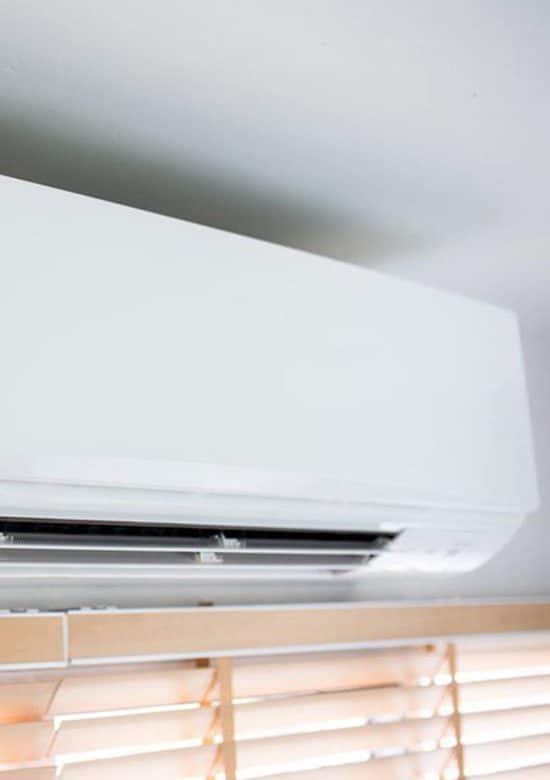 Air Conditioner Unit On Wall — Carpet Cleaning in Proserpine, QLD