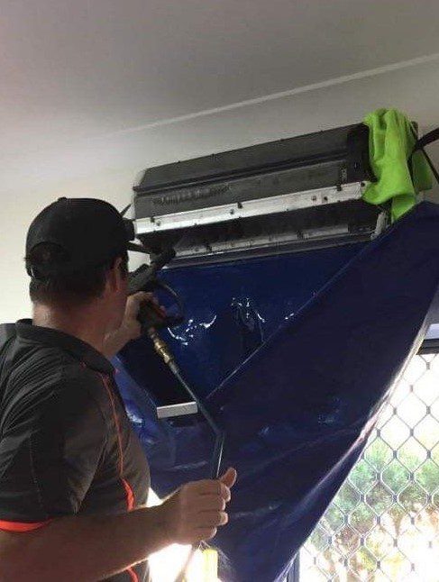 Air Conditioning Unit Getting Cleaned — Air Conditioning Cleaning in Proserpine, QLD