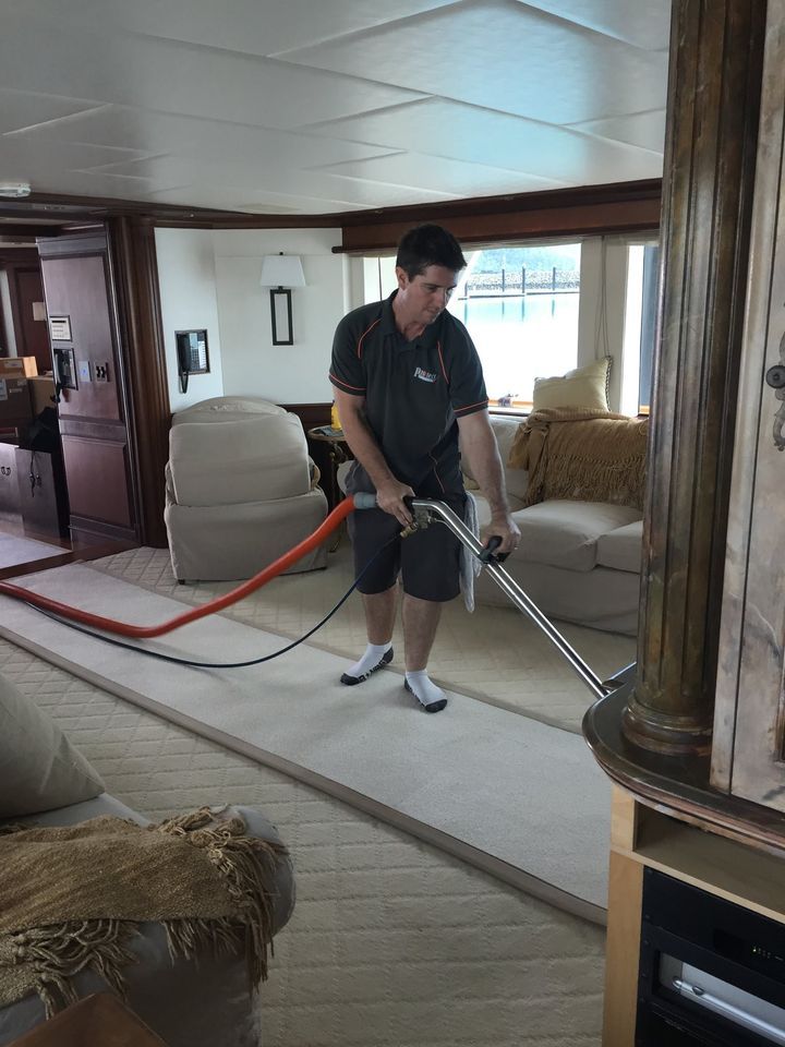 Staff Steam Cleaning Carpet — Carpet Cleaning in Proserpine, QLD