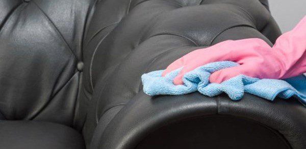 Black Leather Chester Sofa Getting Cleaned — Leather Cleaning in Proserpine, QLD