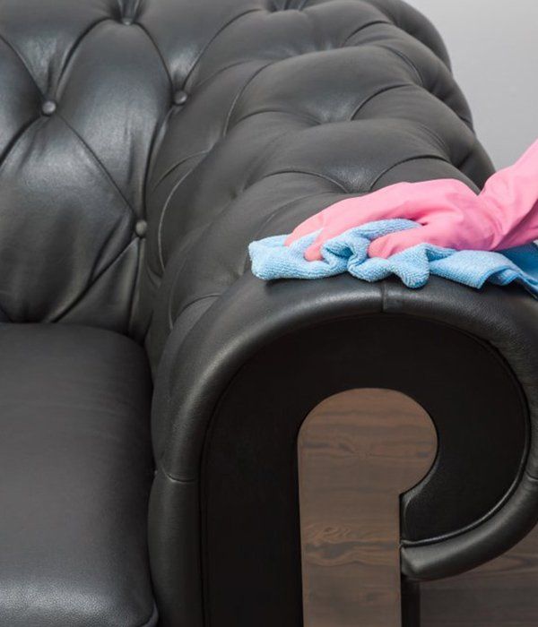 Black Leather Chester Sofa Getting Cleaned — Leather Cleaning in Proserpine, QLD