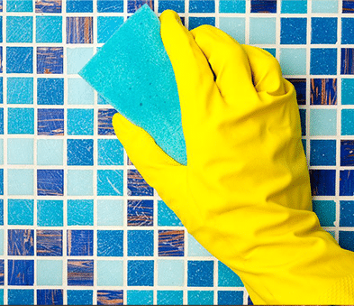 Cleaning Mosaic Wall Tiles With Sponge — Carpet Cleaning in Cannonvale, QLD